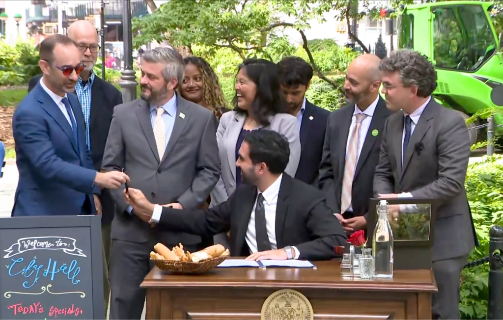 Mayor Signs Year-Round Roadway Dining into Law